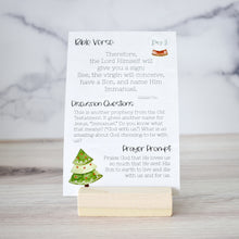 Load image into Gallery viewer, Advent Devotional for Kids in wood stand.  Includes a Bible Verse, discussion questions, and a prayer prompt.