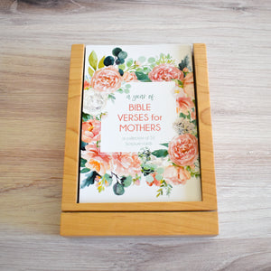 A Year of Bible Verses for Mothers: A Collection of 52 Weekly Scripture Cards decorated with beautiful water colors and stored in wooden tray with slot for display.