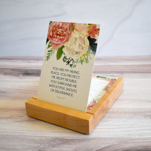 YOu are my hiding place; you protect me from trouble, you surround me with joyful shouts of deliverance.  Psalm 32:7 Scripture Card in Wooden Stand