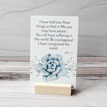 Load image into Gallery viewer, I have told you these things so that in Me you may have peace. You will have suffering in this world. Be courageous! I have conquered the world.  John 16:33 Bible verse with wood stand