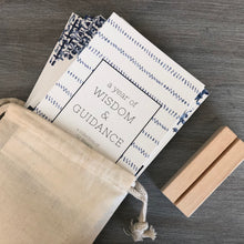 Load image into Gallery viewer, A Year of Wisdom and Guidance Weekly Scripture Bible Verse Cards with stand and cotton bag. Features blue watercolor artwork.