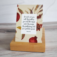 Load image into Gallery viewer, He will cover you with His feathers; you will take refuge under His wings. His faithfulness will be a protective shield. Psalm 91:4 Scripture Card displayed in premium wooden stand from Buhbay.com.