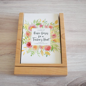 Bible Verses for a Teacher's Heart: Weekly Bible Verses for One Yearto encourage a teacher with a premium wood stand for display and storage. Fits perfectly on a desk.