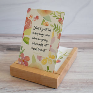 Start a youth out on his way; even when he grows old he will not depart from it.  Proverbs 22:6 Bible Verse Card in a wooden stand for storage and display.